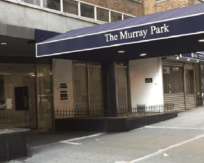 The image shows a building entrance with a sign reading  THE MURRAY PARK  on a blue awning, indicating the location of Murray Park.